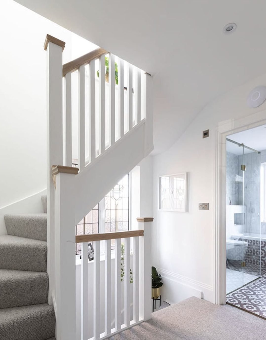 New loft staircase with white spindles and oak handrail