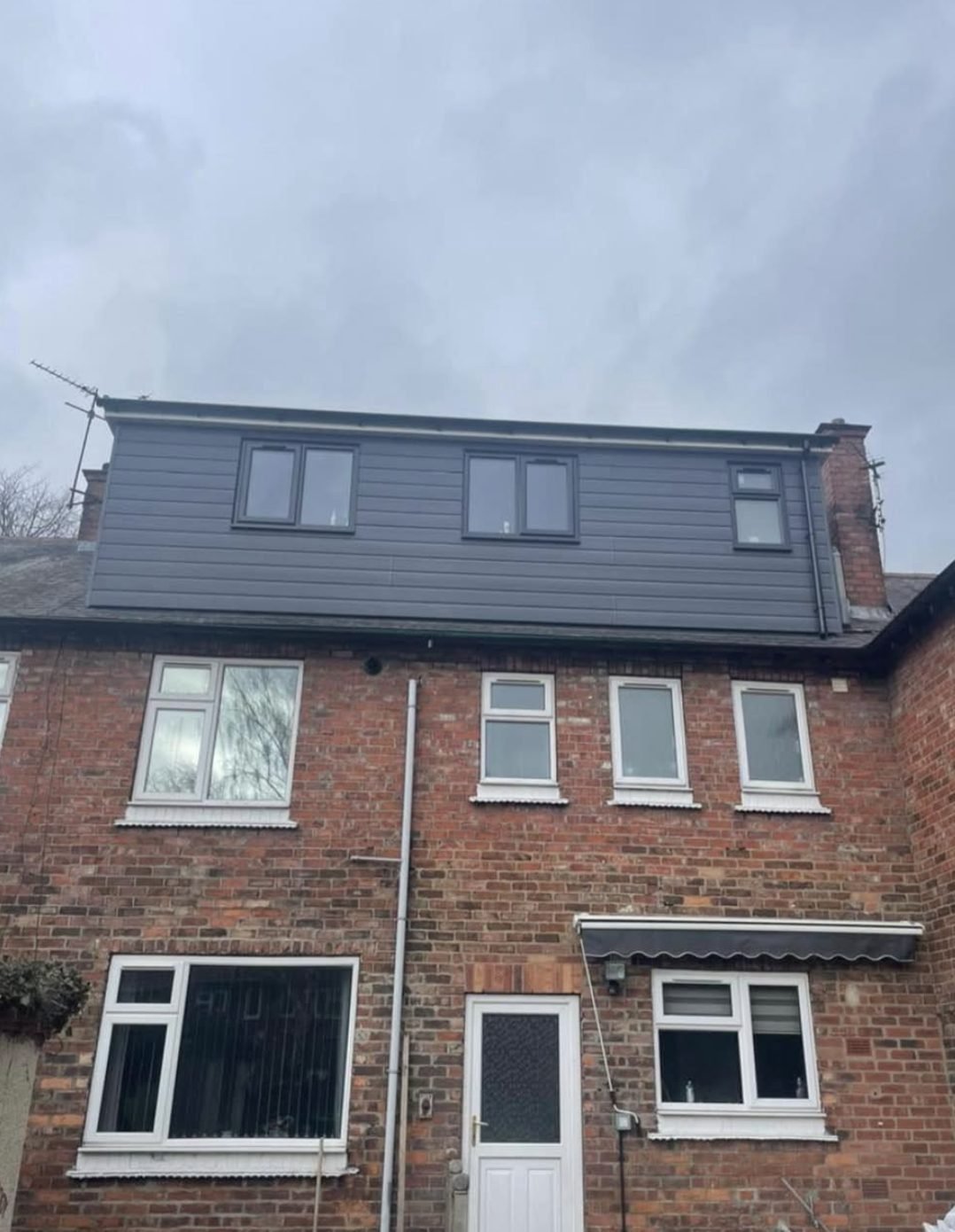 Full-width rear dormer loft conversion finished in grey cladding with three new windows
